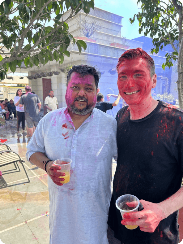 VisibilityStack teammates celebrating Holi outdoors
