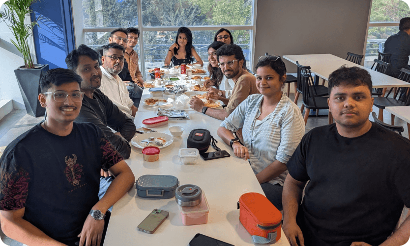 VisibilityStack team gathered around a lunch table